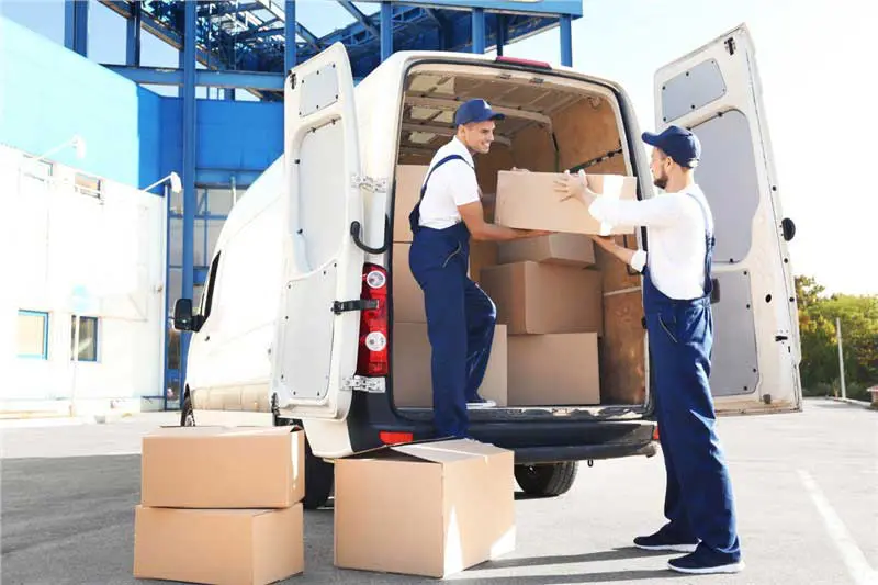 Movers loading a truck in winter at lower off-season rates