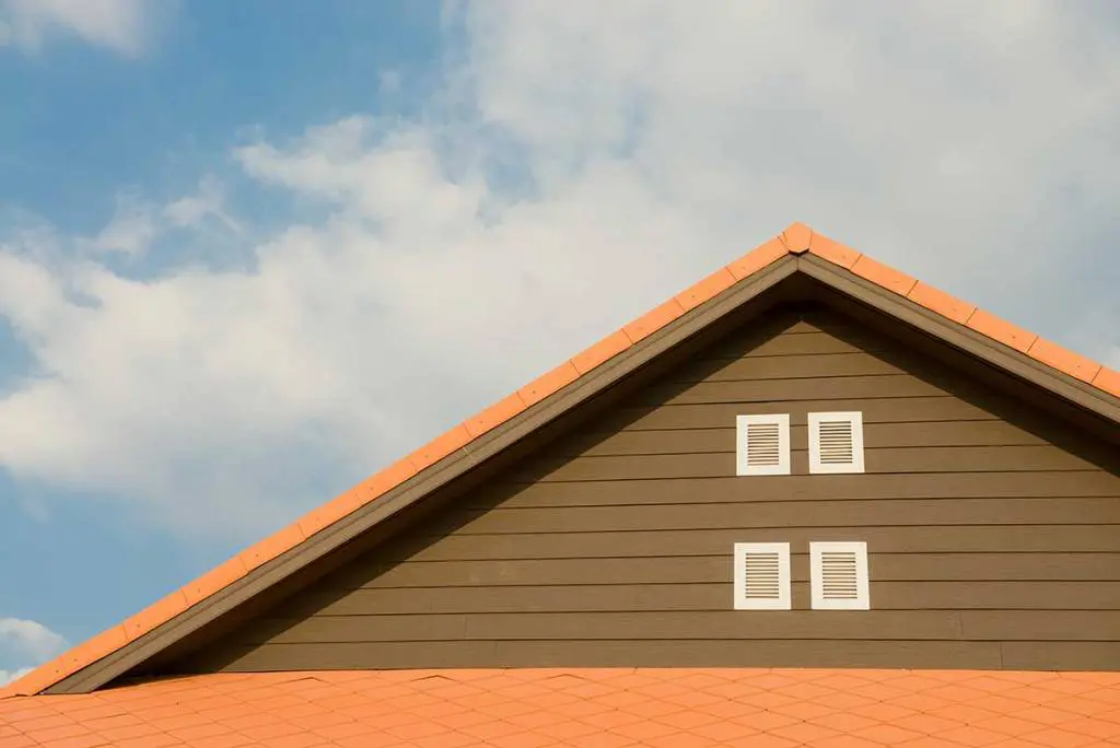 Inspecting the attic during spring home maintenance in Brantford
