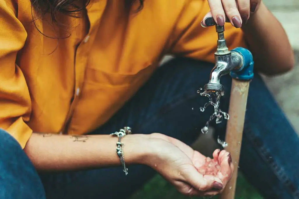 Testing outdoor faucets for freeze damage at a Brantford home