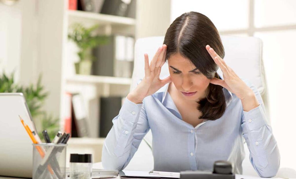 woman stresses over finances and wonders what to do if your house isnt selling